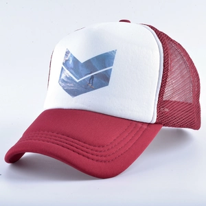 Macro view of burgundy trucker hat showing breathable mesh and surfer graphic print