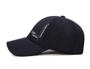 Macro detail of breathable laser-cut holes on navy quick-dry sports baseball cap