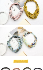 Close-up of floral fabric twisted headbands with elastic back in assorted colors