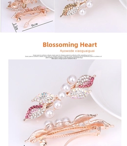 Detailed view of leaf-shaped hair clip with pearls and pink rhinestones, 9cm size