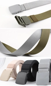 Detail view of multi-color nylon canvas belts with plastic quick-release buckles