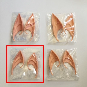 Detail of four pairs of latex elf ears for cosplay in protective plastic packaging
