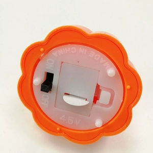 Orange Halloween pumpkin LED candle light base with power switch and battery compartment