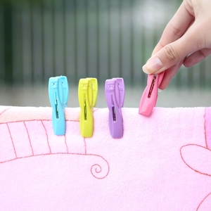 30-piece set of colorful plastic windproof clothespins for laundry drying with storage basket