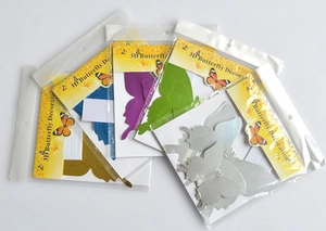 Bulk packs of 3D mirror butterfly wall stickers in blue, purple, green, and silver colors
