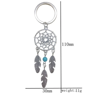 Silver dreamcatcher keychain with metal feathers and turquoise bead shown with dimensions