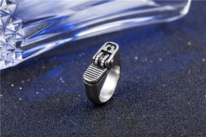 Detailed macro view of vintage lighter-shaped ring with brushed silver-grey metal finish