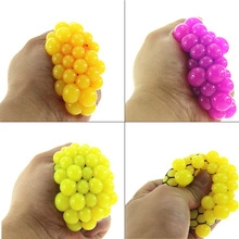 Detailed view of yellow and purple squeeze sensory grape balls for stress relief