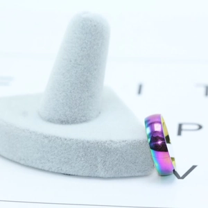 Rainbow plated stainless steel ring with colorful gradient finish and golden inner surface