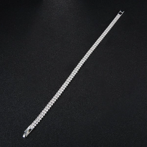 Detail of silver double-row rhinestone tennis bracelet with classic claw setting