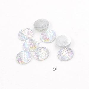Macro shot of 1# white AB mermaid scale resin cabochons with iridescent fish scale texture
