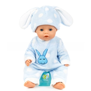 Close-up of realistic baby doll in blue polka dot rabbit onesie with green toy potty
