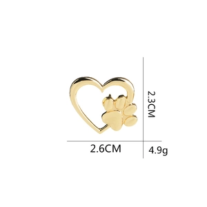 Golden heart dog paw brooch pin measuring 2.6cm by 2.3cm with minimalist cutout design