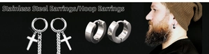 Detail of stainless steel hoop earrings with polished cross pendant on a male model