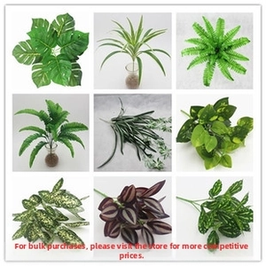 Detail view showing nine types of faux tropical green leaves for DIY floral decor