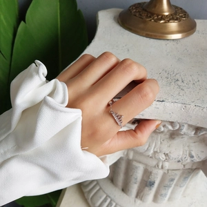 Detail of 925 sterling silver crown ring with micro-pave zircons and chain design