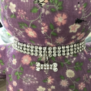 Detailed view of 3-row rhinestone pet collar with sparkling bone-shaped crystal pendant