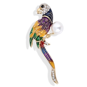 Detail view of colorful enamel parrot brooch with crystals and a white faux pearl