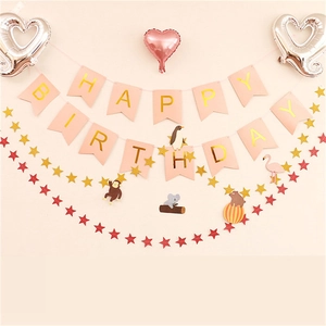 Pink Happy Birthday banner set with star garlands and animal party toppers detail