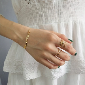 Minimalist gold S925 silver rings and circular sequin bracelet set on hand