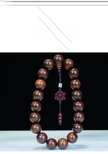 Detail of Rosewood car ornament beads with traditional purple Chinese knot tassel