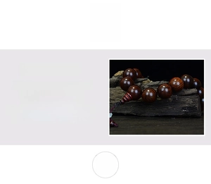 Detailed view of polished rosewood prayer beads with dense grain and natural glossy finish