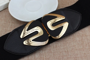 Close-up of black elastic corset belt featuring a gold and black metal interlocking buckle