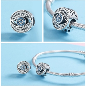 Macro shot of S925 sterling silver evil eye charm with blue zircon stones detail