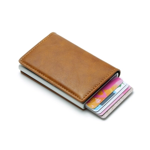 Macro detail of brown leather RFID blocking wallet with aluminum card pop-up mechanism