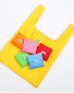 Detail of colorful foldable shopping bags showing folded versus open states in oxford cloth