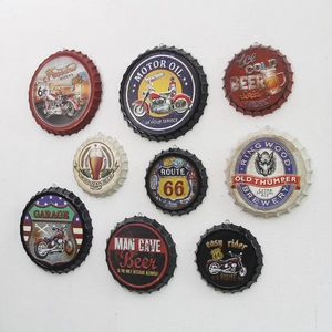 Wall arrangement of vintage beer cap hooks with Route 66 and Motor Oil designs