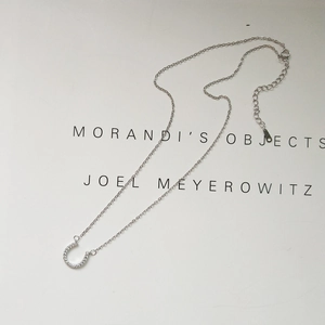 Detail view of 925 sterling silver horseshoe pendant with sparkling micro-pave zircons