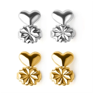 Two pairs of heart-shaped earring lifters in gold and silver finish on a white background
