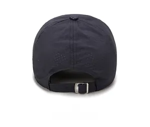 Detail of breathable perforated fabric and adjustable silver metal buckle on sports cap