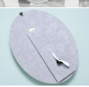 Macro detail of the oval velvet jewelry display board with a foldable support stand