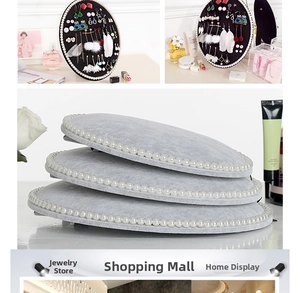 Detailed view of oval jewelry display boards with faux pearl edges and soft velvet surface