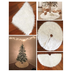 Detail of white long-fleece plush Christmas tree skirt with soft texture and round shape