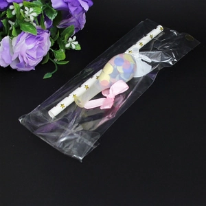 5-inch confetti balloon cake topper kit with gold star straw and pink bow in packaging