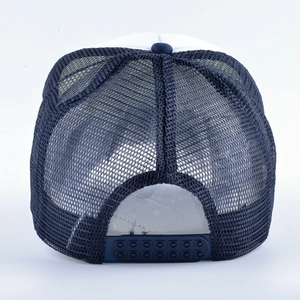 Adjustable navy blue trucker hat with white front panel and breathable mesh back view