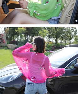 Detailed view of chiffon beach shawl featuring floral embroidery and ruffle cuffs