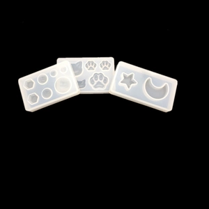 Three-piece set of translucent silicone molds featuring cat paw, moon and star shapes
