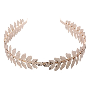 Elegant gold metal laurel leaf headband with baroque bridal tiara design in studio lighting