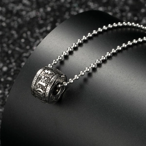Vintage stainless steel necklace featuring a silver lotus pendant with embossed symbols
