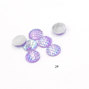 Macro detail of 2# purple iridescent resin fish scale cabochon for DIY jewelry making