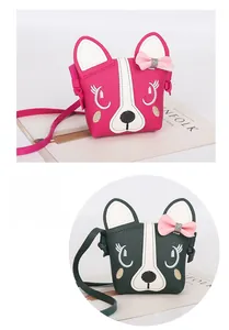 Detail of pink and dark green crossbody bags for kids featuring 3D bow and puppy ears