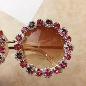 Chic oversized round sunglasses with pink crystals and UV 400 protection coating