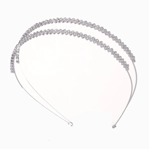 Double-layered silver metal headband with sparkling clear rhinestones on white background