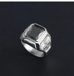 Detailed side view of silver stainless steel ring with rectangular black onyx stone inlay