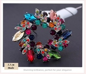 Detailed close-up of 5.3 cm floral rhinestone brooch with multi-colored crystals