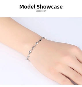 Close-up of minimalist 925 silver heart bracelet with cubic zirconia on model wrist